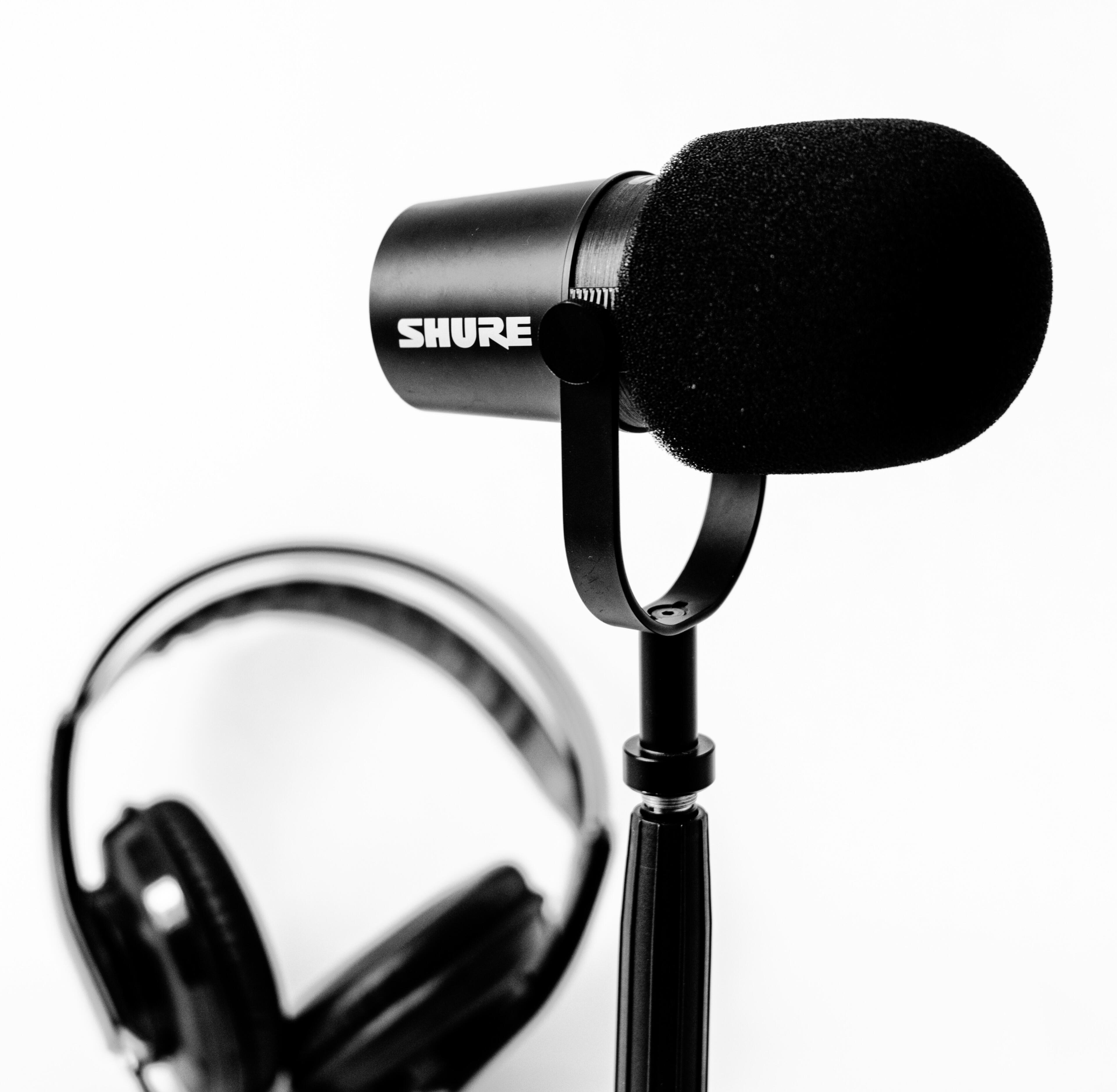 Shure MV7 and headset A pair of black headphone and mic photo